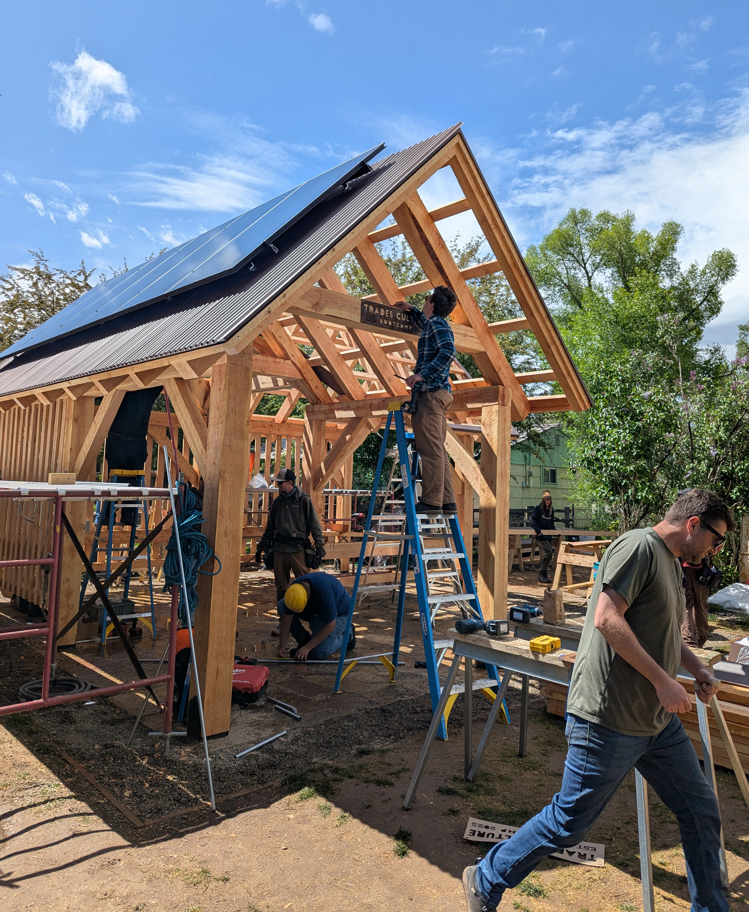 Northern New Mexico College students and professional crews on the construction site for the solar powered gazebo.