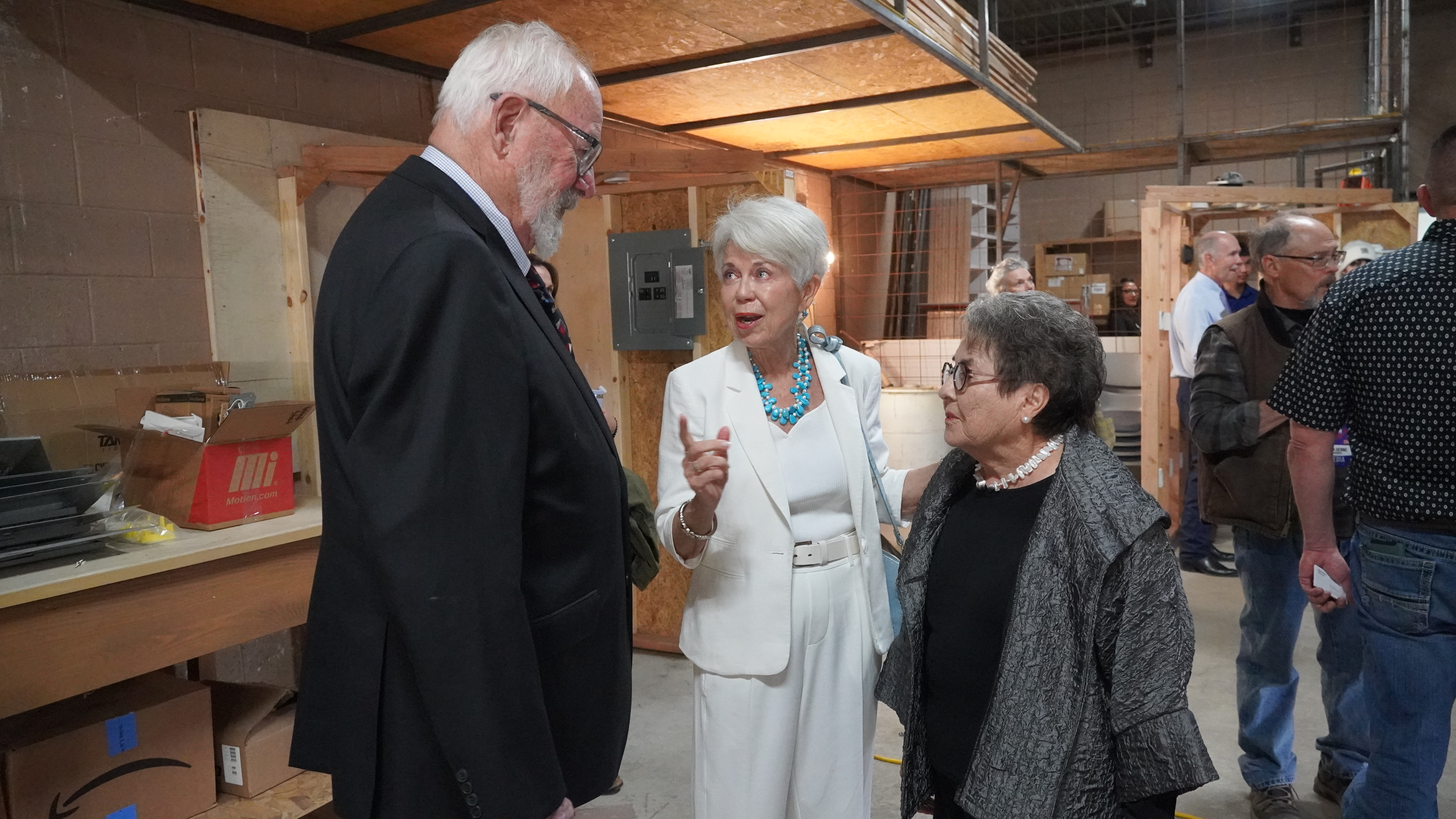 From left: Butch Clark speaks with NNMC Major Gifts Officer Judith Pepper and Glorianna Atencio.